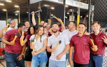 workers out at an axe throwing organization