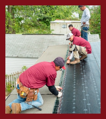 new paradigm project workers on roof installing new shingles